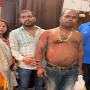 वाराणसी के अस्सी घाट पर गंगा में डूबते व्यक्ति को बचाते हुए पीएसी के जवान।